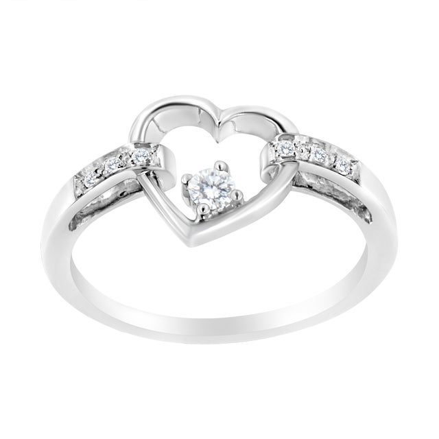 Gift your loved one with this cherished 1/8 c.t. diamond heart ring! This petite and elegant piece is crafted in 14k white...