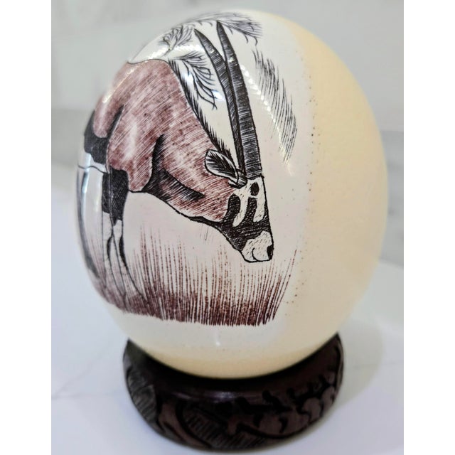 African Mid-Century South African Scrimshaw Ostrich Egg With Engraved Oryx on Carved Wood Stand For Sale - Image 3 of 11