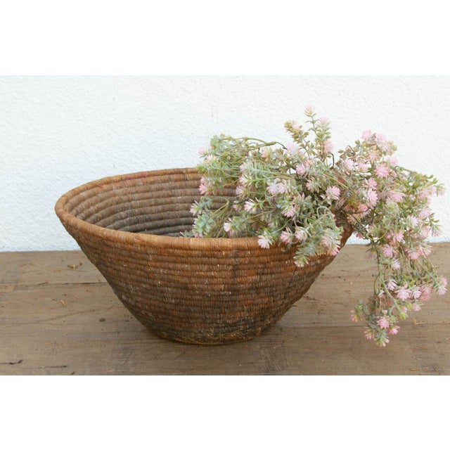 This deeply patinated nomadic harvest bowl is a stunning artifact of daily tribal life. In traditional agrarian societies,...