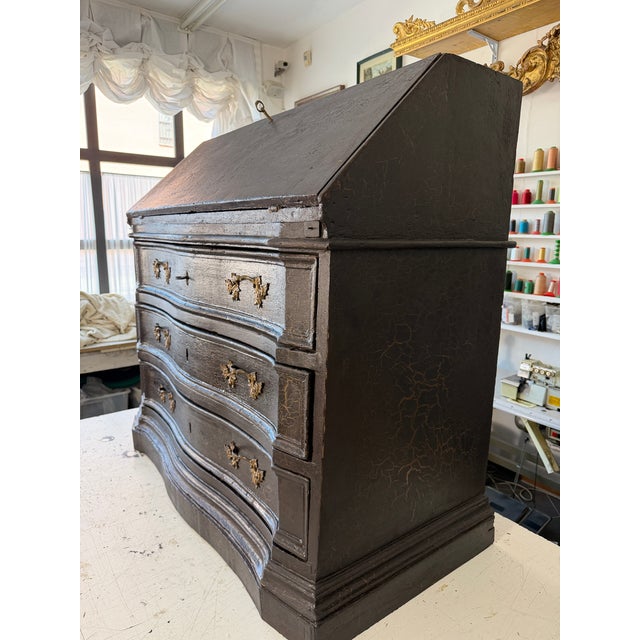 Three-drawer drop-leaf cabinet in brown lacquered wood with provision for lining the inside of the drawers with printed...