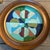2 original round paintings on Masonite Overall size with vintage frame is approximately 10 x 10 both signed bottom right
