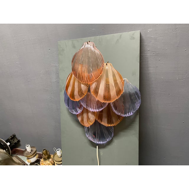 A striking pair of large vintage italian wall sconces dating from the 1980s, featuring an eye-catching arrangement of...