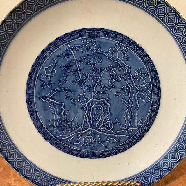 A beautiful Japanese decorative serving dish with artists signature on reverse side that adds a classic blue and white...