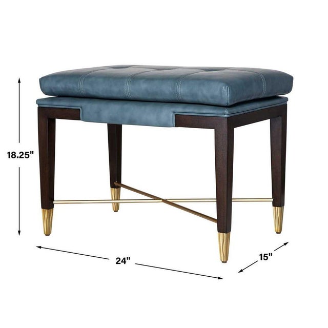 Glam tapered legs are capped with dazzling gold finished metal feet. A removable tufted blue top grain leather seat...