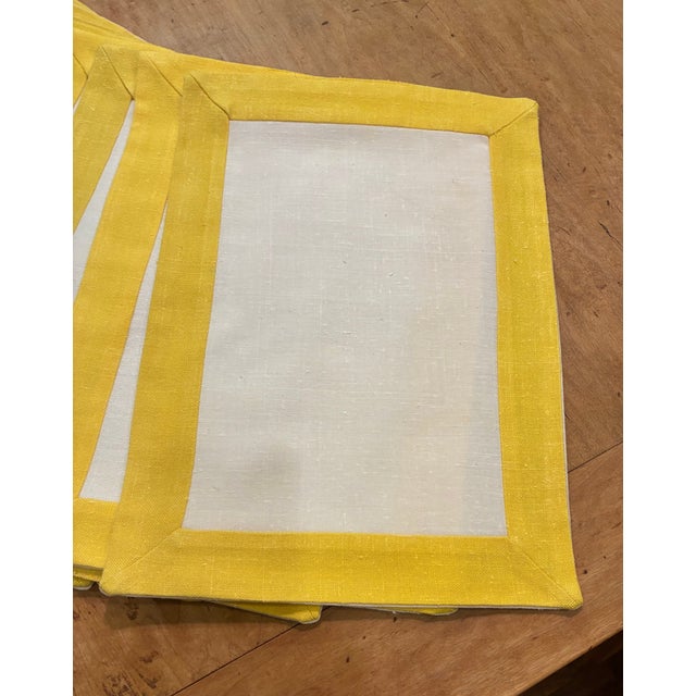 Beautiful custom made fabric placemats, white center with yellow banding. Lined. linen and poly, washable, 12 x 16.