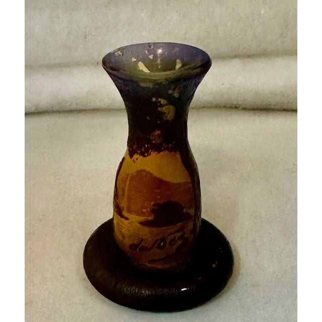 This vintage early 1900’s Continental art glass vase is signed De Vez. The cabinet size miniature is decorated with a...
