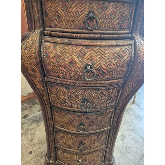 Handsome BoHo chic chest of drawers crafted in wicker and woven reed and painted reed in a Bombay form with six drawers...