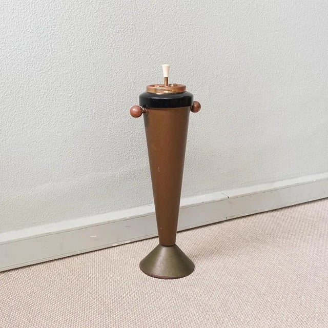 This astray was produced in Italy and is original from the 1950's. It is made of brass and iron, and on the top is the...