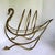 Here is a striking vintage brass magazine rack, likely dating to the mid to late 20th century, designed in the form of an...
