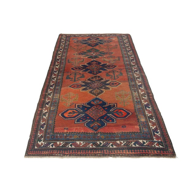 Antique decorative wool handknotted Caucasian rug. Approximately 75-85 years old. In very good condition.