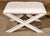 Mid-Century Modern style benches with criss-cross x-frames. Leather covered with exposed nail heads.
