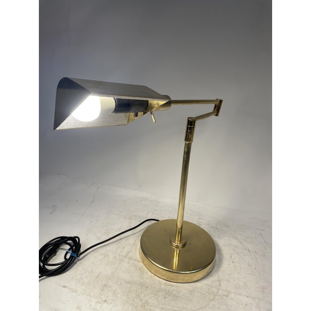 80s designer table lamp, produced by F. Fabbian Made in Italy. Perfectly functional, adjustable arm. Slight curvature of...