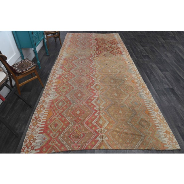 Vintage Hand-Knotted area rug is a semi-antique vintage area rug. The '70s Eastern region of Anatolia's unique rug is...