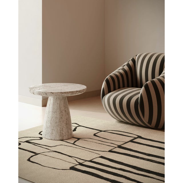 The Gaya Armchair Stripes blends modern design with mid-century charm, creating an inviting living space. The accent...