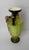 A richly glazed antique majolica-style vase dating to the late Victorian–Edwardian period. Featuring twin loop handles,...