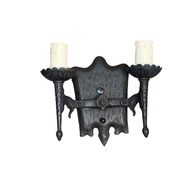 We have a total of 2 pair (4 sconces) of these cast iron wall sconces in the Spanish Colonial style. New wiring and switches.