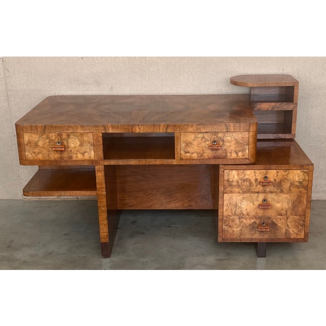 Art Deco Desk in Burl Walnut. Beautiful Desk with two faces. In one side you can use like a desk, with five drawers and...