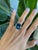 A remarkable 16.87-carat London blue topaz pools with deep, inky blue at the center of this solid 14K yellow gold ring,...