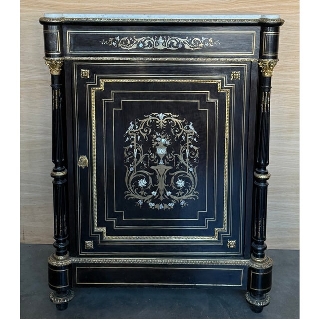 This 19th-century cabinet is a beautiful example of the Napoleon III style, characterized by elegance and refinement. It...