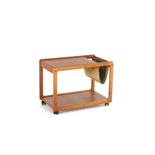 This beautiful mid-century modern trolley exudes timeless elegance. Crafted from warm teak, this model stands out with two...