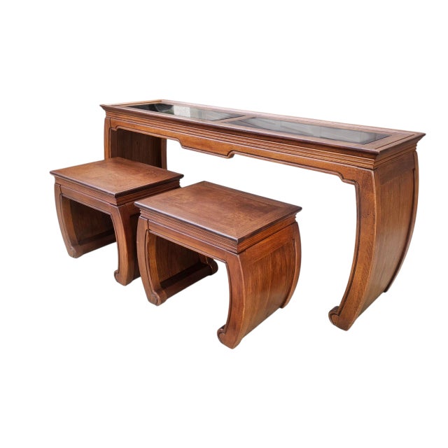 This is a beautiful set by Thomasville. A Ming style scroll table with matching stools, made of mahogany with burlwood and...