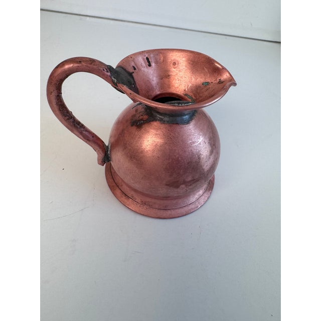 A Gill measures is half a pint or 4 ounces. This could be used as a creamer, to water plants or add to a growing jug...
