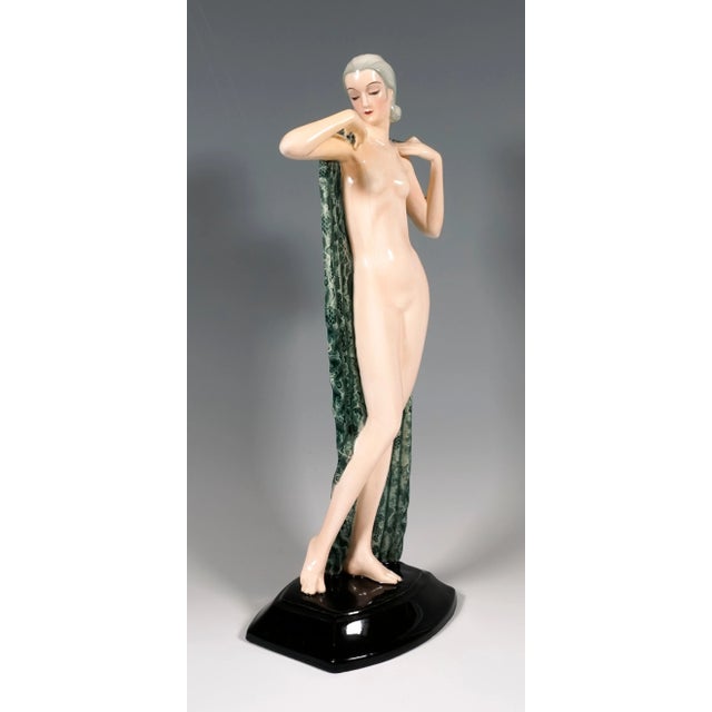 Very rare goldscheider ceramic figurine of the 1930s: the standing pretty young lady with her hair combed back and pinned...