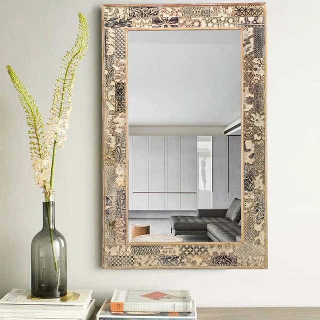 Dimensions: 30" W x 2" D x 48" H This piece utilizes old printing blocks that were once use to print fabric. It is...