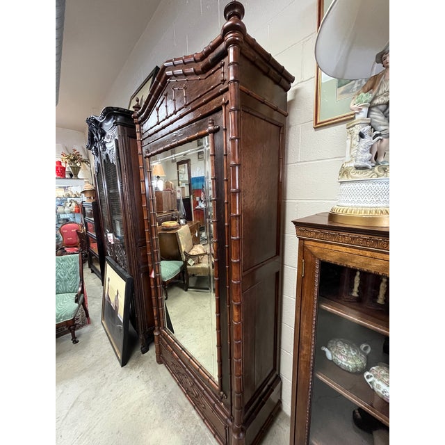 Up for your consideration is a fabulous full bamboo armoire with an amazing bubbled mirror inserted. There is also a...