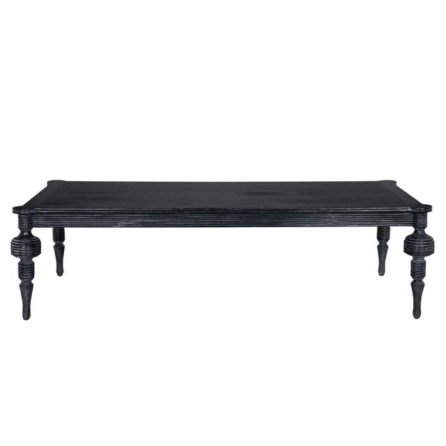 The Stockholm Coffee Table is a masterpiece of modern design and elegance. With its spacious 65-inch surface, robust Mindi...