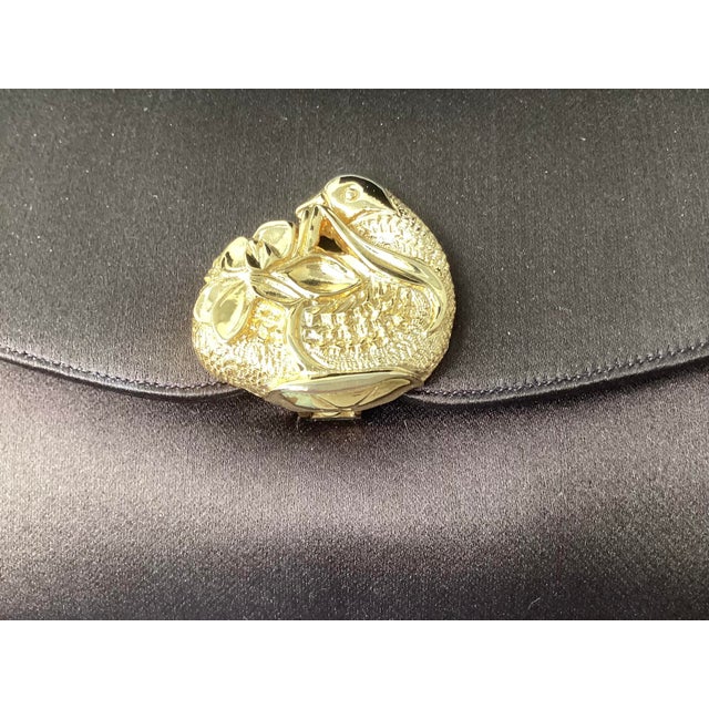 Judith Leiber brown satin evening bags are timeless luxury pieces coveted for their fine material, sophisticated design,...