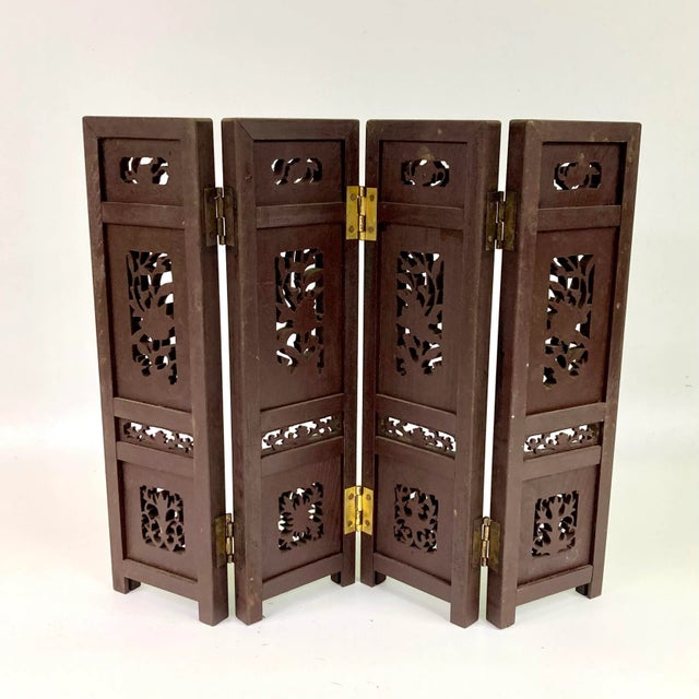 Beautiful small panel hand carved in wood with floral motif.