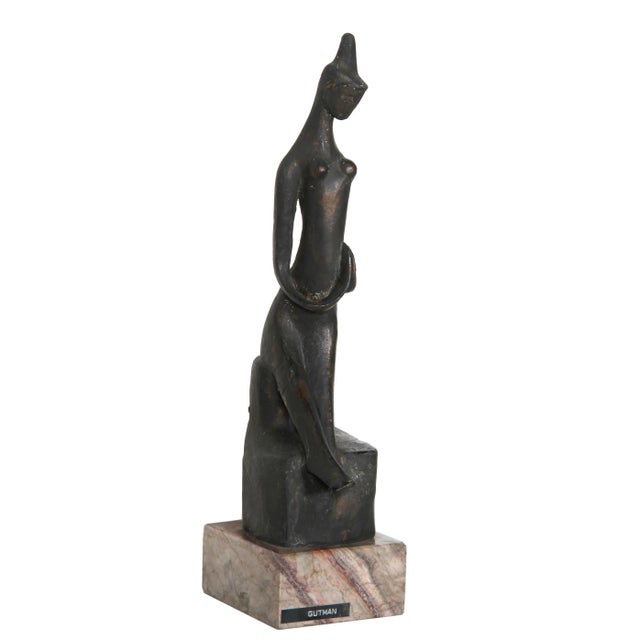 Artist: Ruth Gutman, American Title: Praying Woman Medium: Bronze with Patina on a Marble Base, signature engraved Size:...