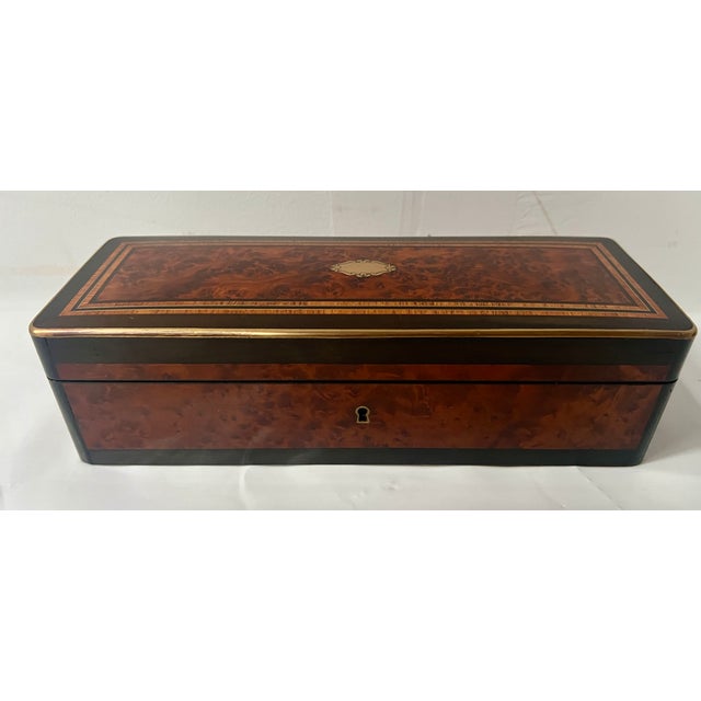 Glove box in thuya burl veneer Central medallion in engraved brass marquetry Inlaid with black and light wood stringing...