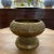 Classic mid century brass pedestal cachepot with Asian influence and modern design. Nicely-aged brass finish and an...