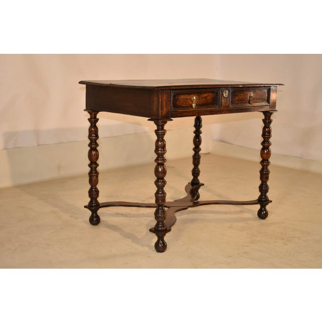 Late 17th/early 18th century oak side table from England. The top has lovely patina and graining, and has a beveled edge,...