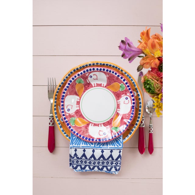 This colorful Campagna Porco Coupe Pasta Bowl features whimsical handpainted pigs and carrots. Care Instructions:...