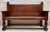 Impressive antique Spanish bench crafted in solid oak, featuring a strong architectural design characteristic of...