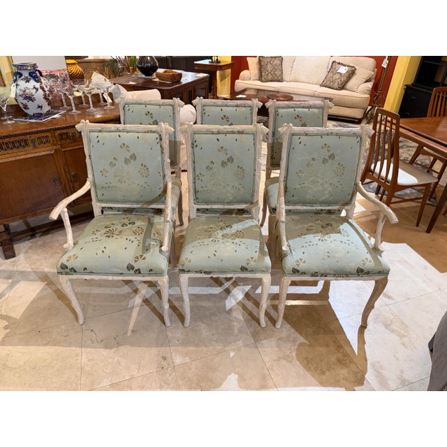 Bring whimsical, organic elegance to your dining room with this striking set of six Italian Regency style dining chairs....