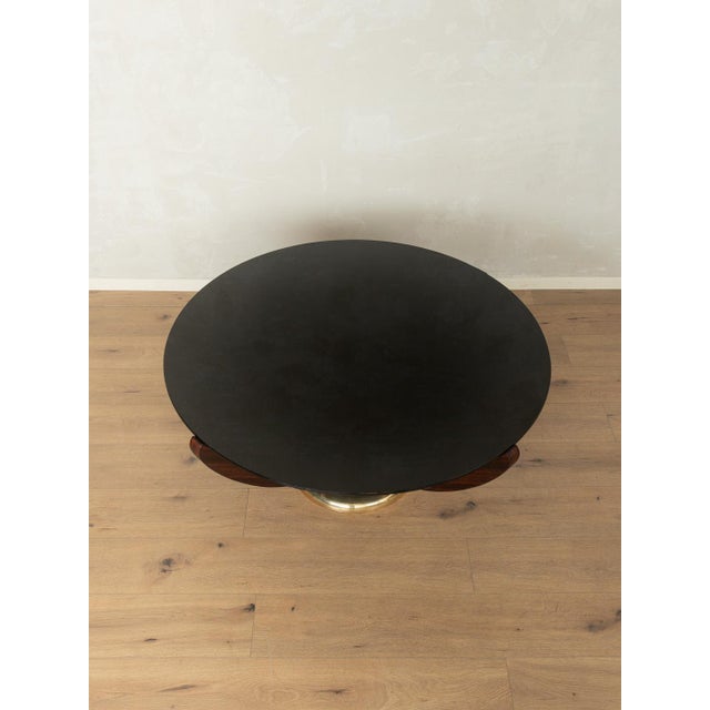 A stunning Art Deco coffee table from the 1930s by Wilhelm Renz. It features a high-quality solid teak frame with a brass...