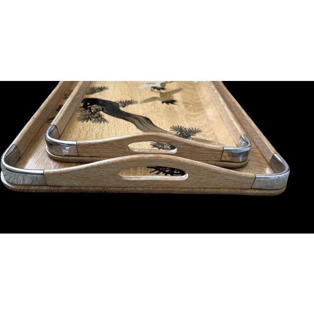 The product is a set of 2 vintage Mid-Century hand-painted bamboo shoot nesting trays, made in Japan. These rectangular...