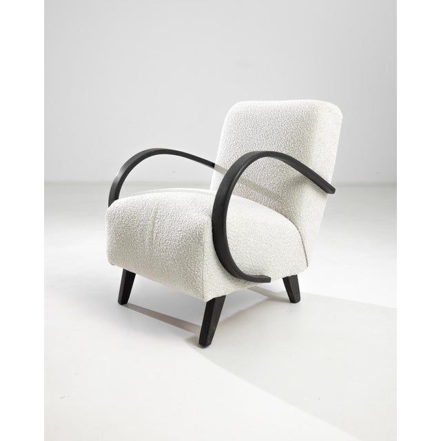 Introducing the 1950s Czech Wooden Armchair by J. Halabala, a timeless piece that combines vintage charm with modern...