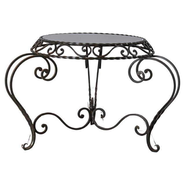 Immerse yourself in the vintage charm of this 1950s French metal coffee table, a piece that effortlessly encapsulates the...
