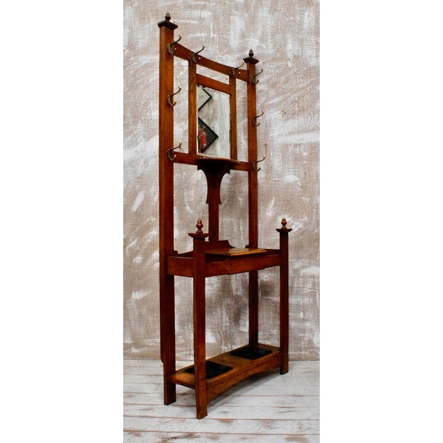 A Superb Antique Arts and Crafts Oak Hall Stand. Made from English Oak, complete with 8 original brass coat hooks, hand...