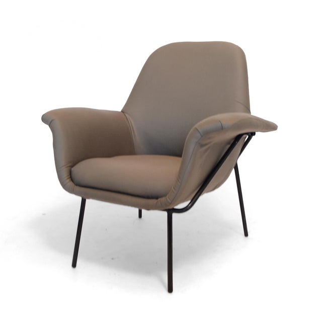 A rare piece, this elegant and comfortable "Lucania" easy chair by Giancarlo De Carlo has an upholstered body supported by...