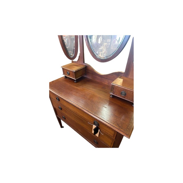 This beautiful antique inlaid dresser with an attached triple folding mirror came out of an estate in West Jefferson, NC....