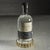 Balancing modern elegance with natural sophistication, this round stainless steel wine bottle coaster features a matte...