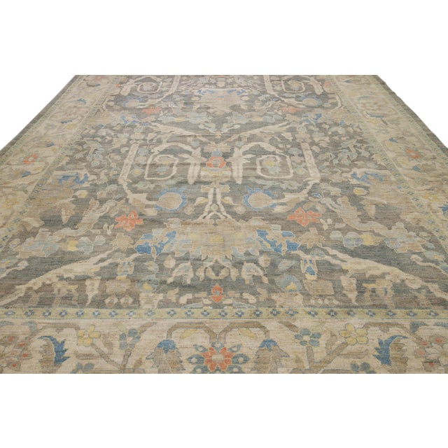 This contemporary sultanabad oriental rug, featuring a meticulously woven central medallion surrounded by graceful floral...