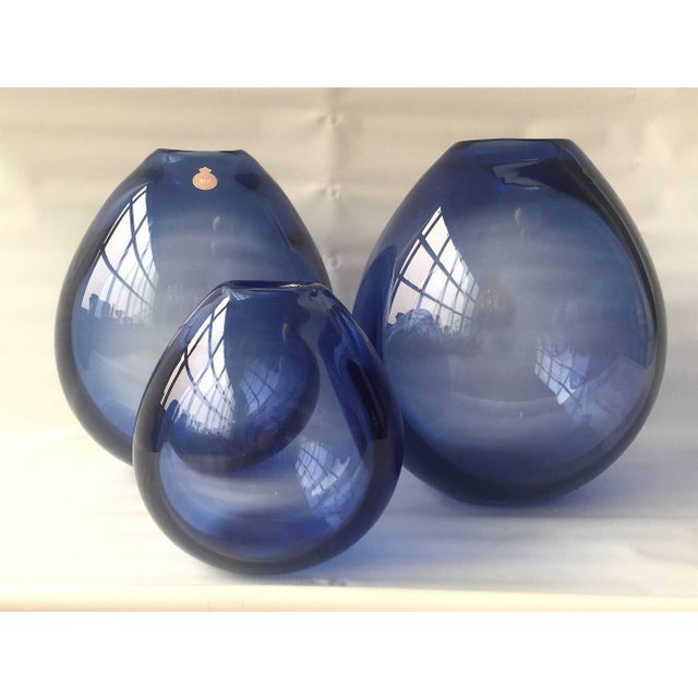 A set of three drop vases by Per Lutken for Holmegaard, Denmark, circa 1950s. Dimensions: H. 24 (9.5") and 16 cm. (6.5")...