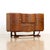 This vintage cocktail cabinet credenza was designed and manufactured by Beautility Furniture in England during the 1950s....
